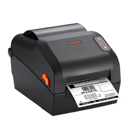 A black Bixolon thermal label printer with an orange accent button and a printed barcode label emerging from the front, shown on a solid white background.