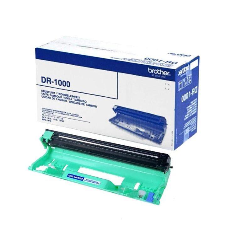 A Brother DR-1000 toner cartridge in a mint green plastic housing with a black drum roller, shown in front of its blue and white retail box on a white background.