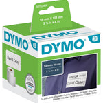 Dymo white plastic label refill tape in its original retail blister packaging, featuring a black tape roll inside a clear plastic casing on a green and white card backing.