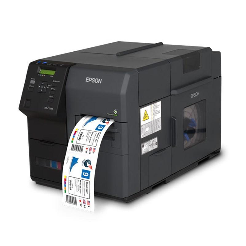 An Epson thermal label printer with a black chassis, showing a label strip being printed and ejected from the front on a white background.
