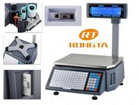 A digital scale with a blue weighing platform, a black and gray control panel with a numeric keypad, and an overhead display screen showing blue text on a white background.