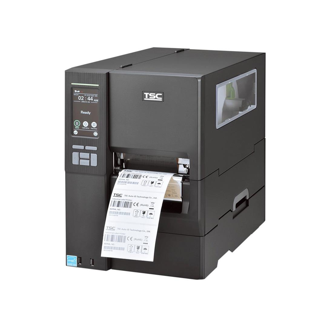 A black TSC industrial barcode label printer with a digital control panel on the left side and a label sheet emerging from the front output slot, shown on a plain white background.