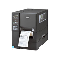 A black TSC industrial barcode label printer with a digital control panel on the left side and a label sheet emerging from the front output slot, shown on a plain white background.