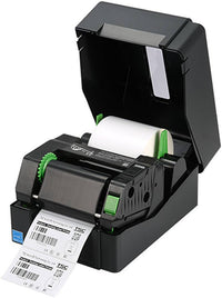 A black thermal label printer with its lid open, showing a white label roll inside and a printed label sheet coming out. The printer has small green accents and is photographed on a plain white background.