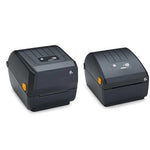 Two black Zebra thermal label printers shown side by side on a plain white background, with one printer displaying a ZEBRA logo on the top panel.