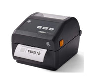A Zebra ZD2420 thermal label printer in black, shown at a three-quarter angle with a printed label partially ejected from the front. The printer features a small orange indicator light and the ZEBRA brand name on the top panel.