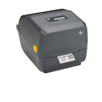 A dark gray ZTECH thermal label printer with a small yellow button on the side and a white product label on the front, shown on a plain white background.