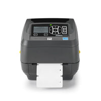 A Zebra QR-ZD500R barcode label printer in dark gray, shown with a white label sheet partially ejected from the front. The printer features a black control panel with a small LCD screen and directional buttons, set against a clean white background.